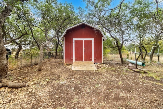 view of shed featuring a fenced backyard