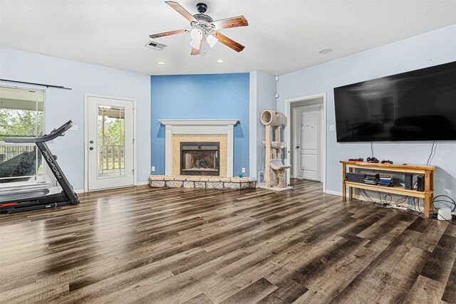 3640 Big Divide Rd, Copperas Cove, TX 76522 - living room with a ceiling fan, wood finished floors, a stone fireplace, and recessed lighting