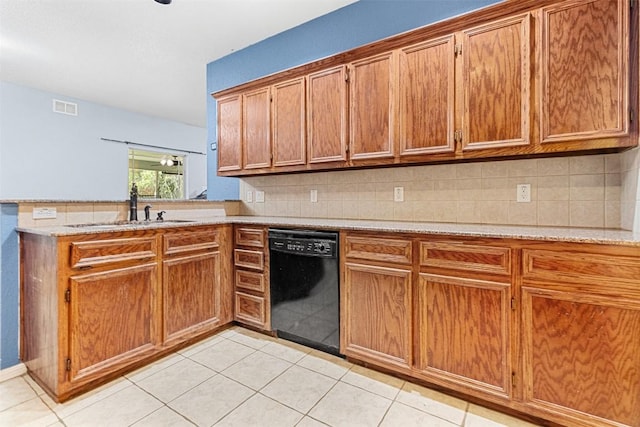 kitchen featuring a sink, visible vents, black dishwasher, light countertops, and brown cabinets