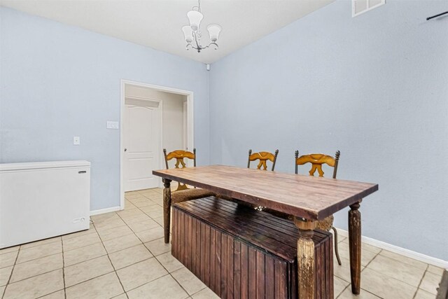 3640 Big Divide Rd, Copperas Cove, TX 76522 - dining room with light tile patterned floors and a chandelier