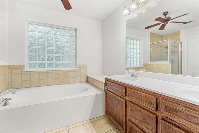 3640 Big Divide Rd, Copperas Cove, TX 76522 - bathroom with a ceiling fan, a shower stall, a garden tub, double vanity, and tile patterned floors