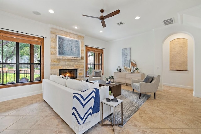 41 Tiburon Dr, The Hills, TX 78738 - living area with ceiling fan, crown molding, light tile patterned floors, a stone fireplace, and recessed lighting