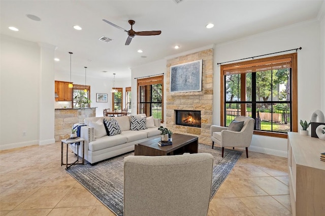 living area featuring recessed lighting, visible vents, a fireplace, and baseboards