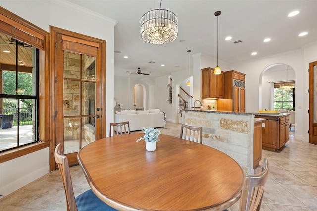 41 Tiburon Dr, The Hills, TX 78738 - dining room with arched walkways, recessed lighting, a chandelier, light tile patterned floors, and ceiling fan