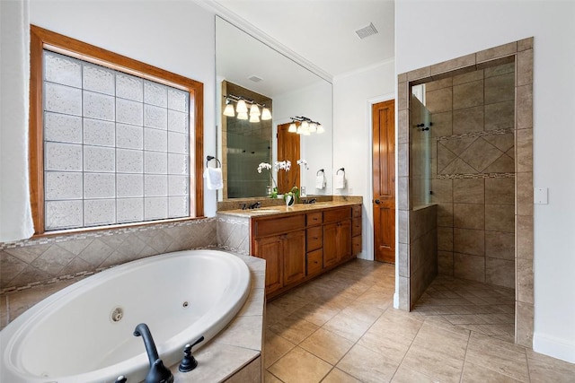 41 Tiburon Dr, The Hills, TX 78738 - full bath with a whirlpool tub, double vanity, a tile shower, ornamental molding, and tile patterned floors