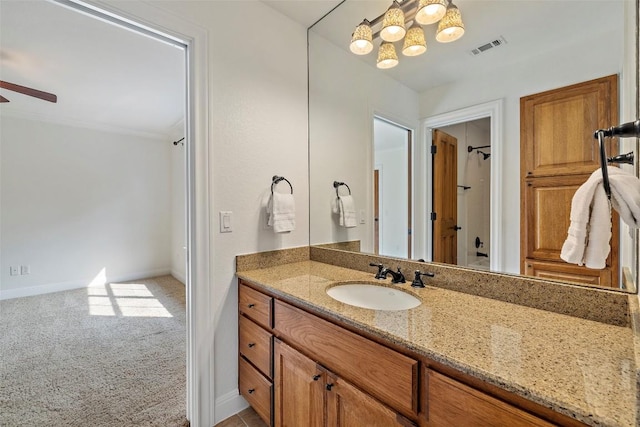 41 Tiburon Dr, The Hills, TX 78738 - full bath with vanity, a ceiling fan, and a chandelier