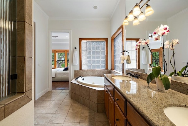 41 Tiburon Dr, The Hills, TX 78738 - bathroom featuring a tub with jets, double vanity, tile patterned floors, connected bathroom, and crown molding