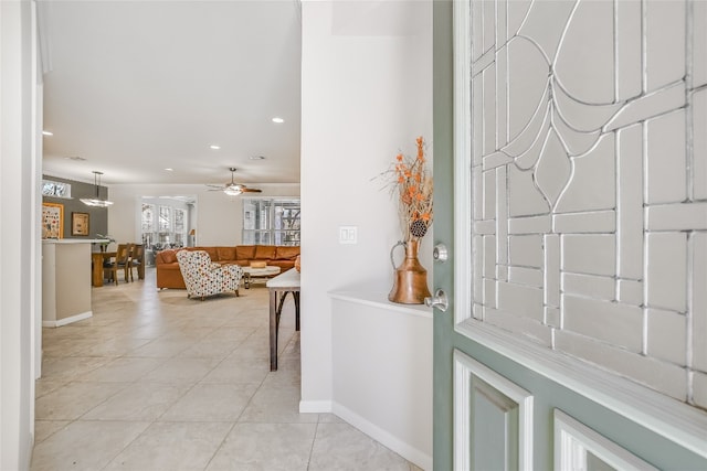 entryway featuring ceiling fan, light tile patterned flooring, baseboards, and recessed lighting