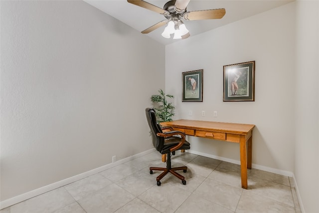 office area with a ceiling fan, baseboards, and light tile patterned floors