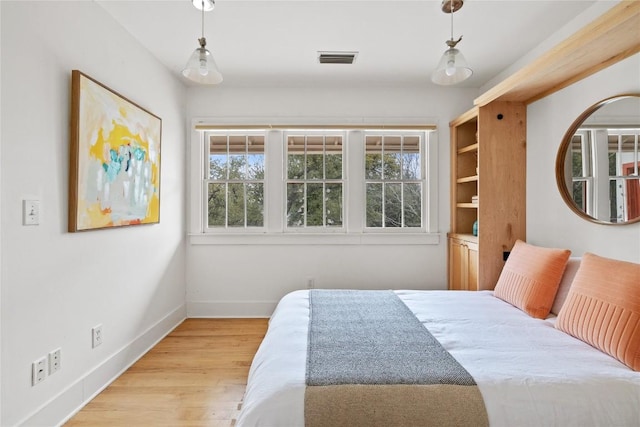 5242 Mccormick Mountain Dr Unit E, Austin, TX 78734 - bedroom with multiple windows and light wood finished floors