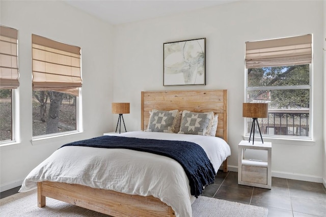 5242 Mccormick Mountain Dr Unit E, Austin, TX 78734 - bedroom with baseboards and tile patterned floors