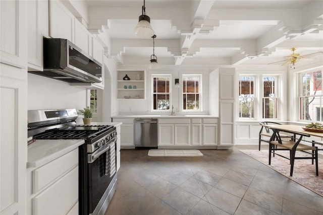 5242 Mccormick Mountain Dr Unit E, Austin, TX 78734 - kitchen featuring appliances with stainless steel finishes, coffered ceiling, white cabinets, beamed ceiling, and light countertops