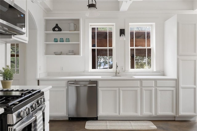 5242 Mccormick Mountain Dr Unit E, Austin, TX 78734 - kitchen with appliances with stainless steel finishes, open shelves, white cabinetry, and light countertops