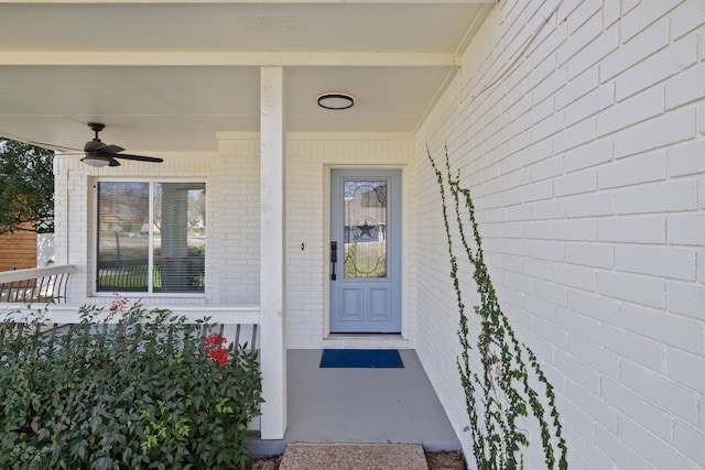 property entrance with visible vents and a ceiling fan