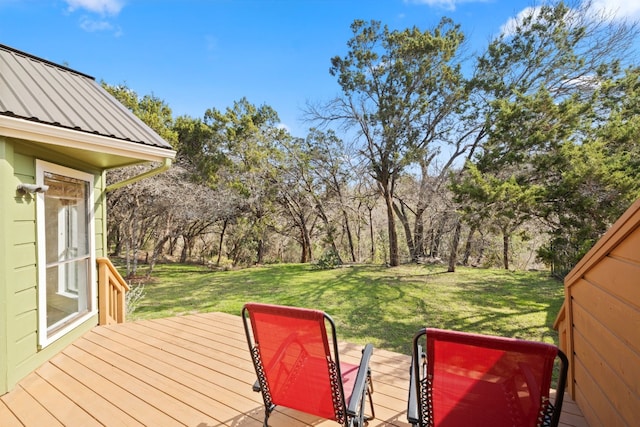 wooden deck featuring a yard