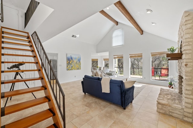 living area featuring visible vents, stairway, beamed ceiling, high vaulted ceiling, and light tile patterned flooring