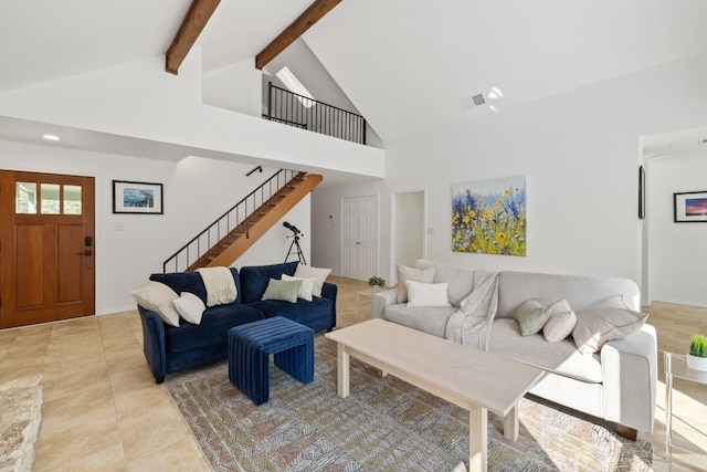 living room with light tile patterned floors, high vaulted ceiling, visible vents, stairs, and beam ceiling