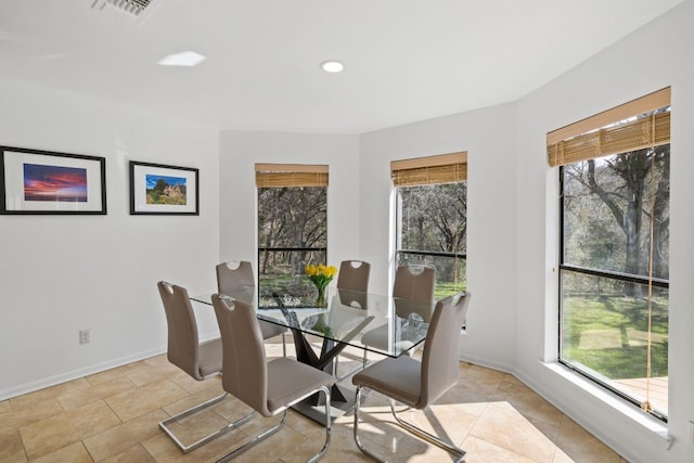 dining room with recessed lighting, visible vents, and baseboards