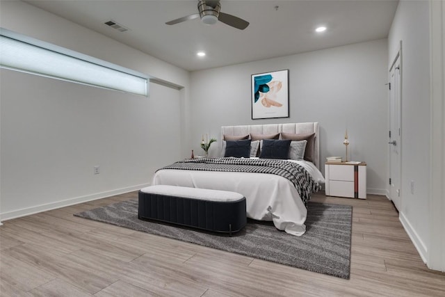 4361 S Congress Ave Unit 504, Austin, TX 78745 - bedroom with light wood finished floors, recessed lighting, and a ceiling fan