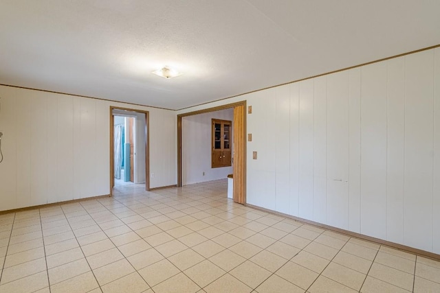 spare room with light tile patterned floors