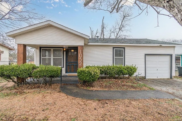 view of front of property featuring driveway and an attached garage