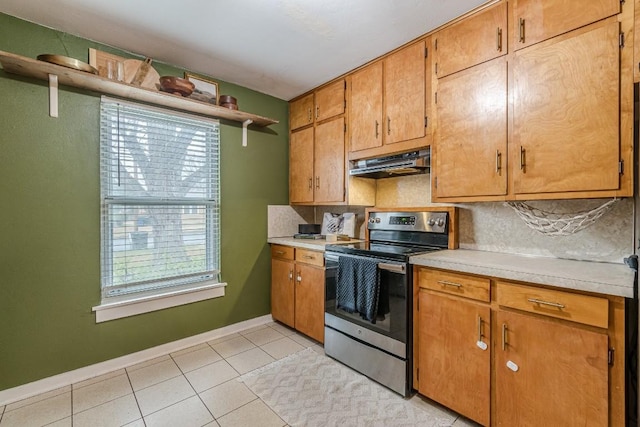 kitchen with light tile patterned floors, under cabinet range hood, light countertops, open shelves, and stainless steel range with electric stovetop