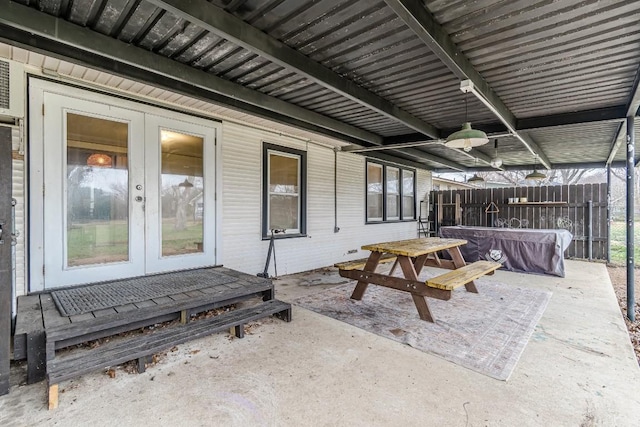 view of patio / terrace with french doors and fence