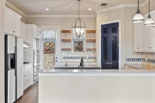 kitchen featuring visible vents, hanging light fixtures, open shelves, and white cabinetry