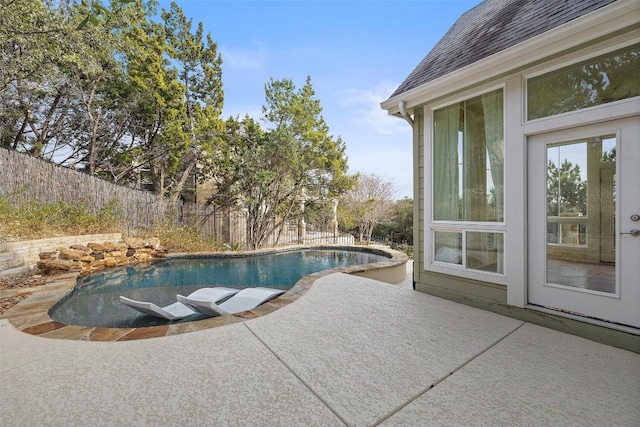 view of pool with a patio area, a fenced backyard, and a fenced in pool