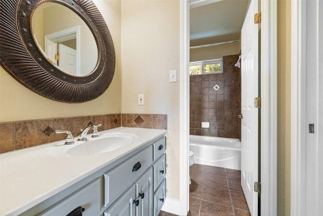 full bath featuring toilet, tile patterned floors, bathtub / shower combination, and vanity