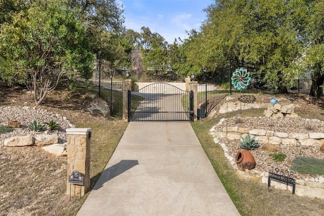 view of gate featuring fence