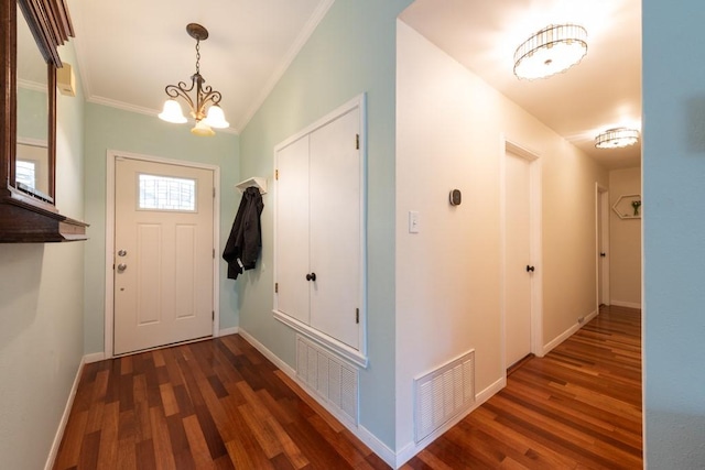entrance foyer featuring visible vents, dark wood finished floors, and baseboards