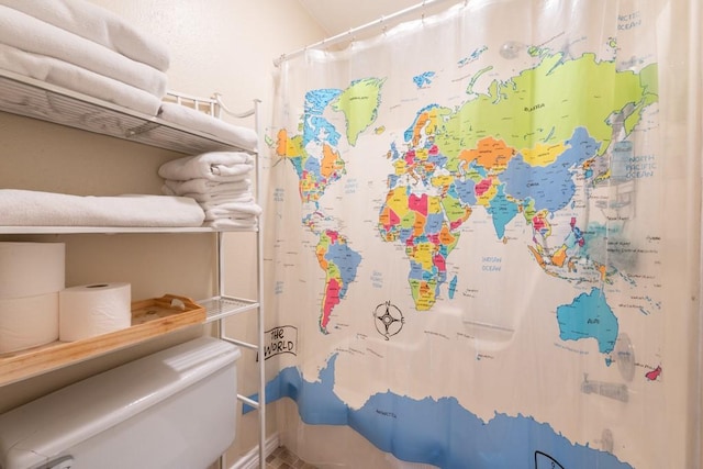 bathroom with a shower with shower curtain