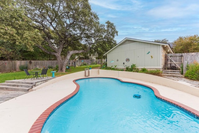 view of swimming pool featuring a fenced backyard and a fenced in pool