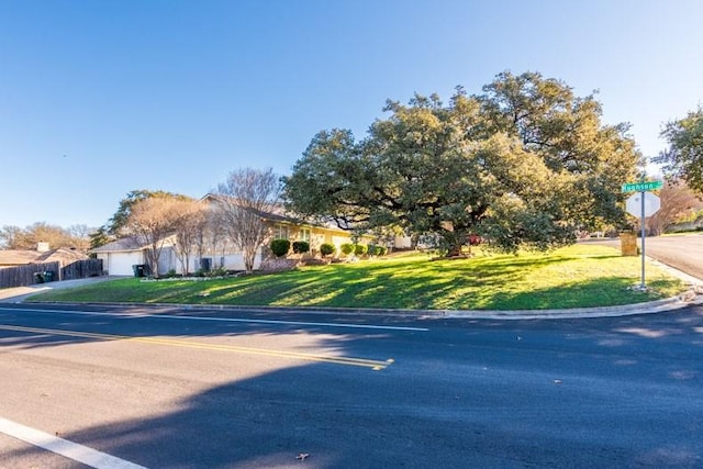 view of street with curbs