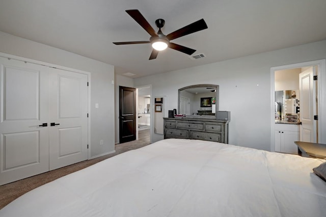 bedroom featuring ensuite bathroom, ceiling fan, visible vents, a closet, and dark colored carpet