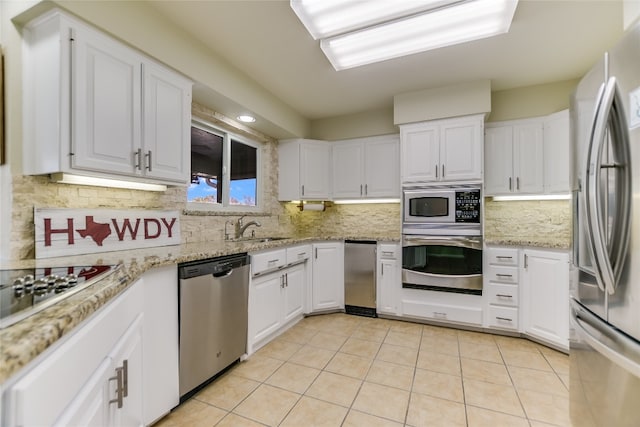100 Boot Hl, Horseshoe Bay, TX 78657 - kitchen with stainless steel appliances, white cabinets, and a sink