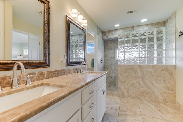 100 Boot Hl, Horseshoe Bay, TX 78657 - full bathroom featuring double vanity, visible vents, walk in shower, and a sink