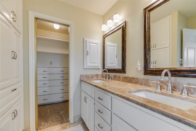 100 Boot Hl, Horseshoe Bay, TX 78657 - bathroom featuring double vanity, a closet, and a sink
