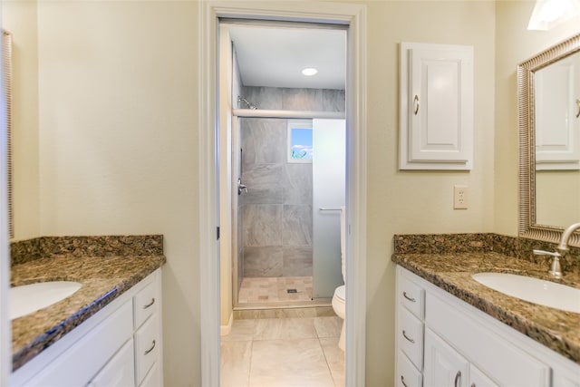 100 Boot Hl, Horseshoe Bay, TX 78657 - bathroom with a stall shower, two vanities, a sink, and toilet