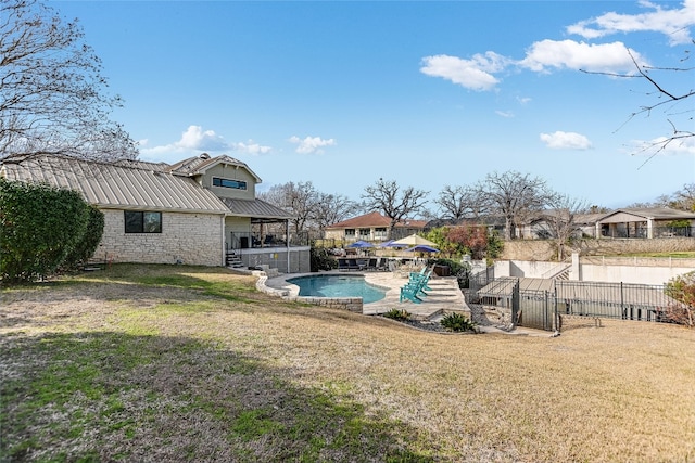 100 Boot Hl, Horseshoe Bay, TX 78657 - view of swimming pool featuring a fenced in pool, a residential view, fence, and a lawn