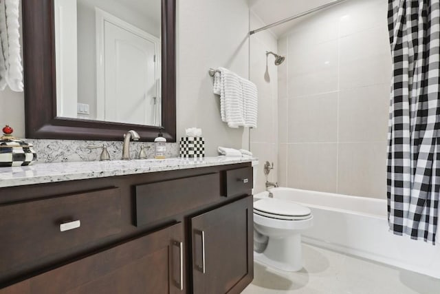 bathroom featuring toilet, shower / bath combo with shower curtain, and vanity