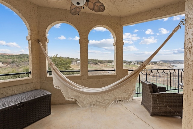 exterior space with a rural view and ceiling fan