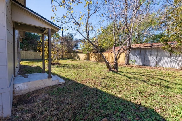 view of yard with a fenced backyard