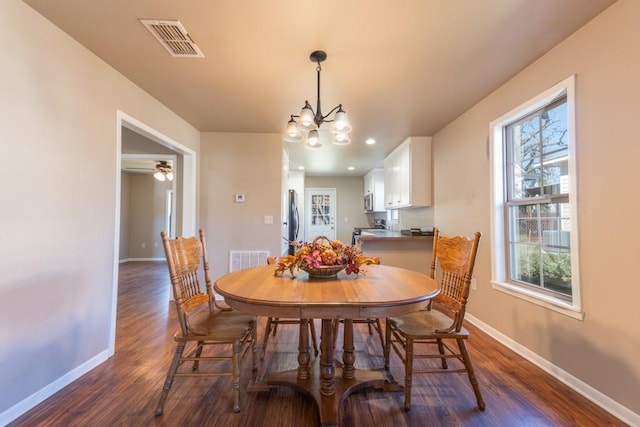 404 S Oak Ave, Luling, TX 78648 - dining space featuring dark wood finished floors, baseboards, a chandelier, and recessed lighting