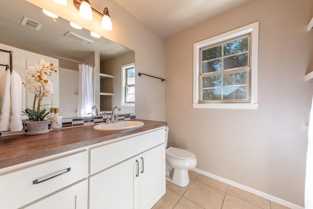 full bath with tile patterned flooring, visible vents, vanity, and toilet