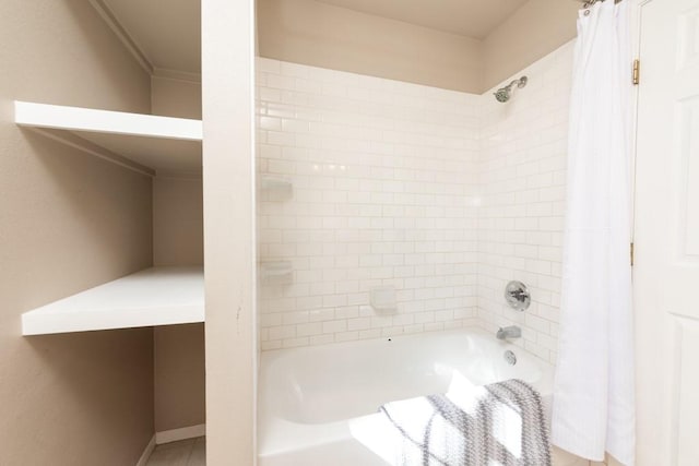 full bathroom with shower / bath combination with curtain, baseboards, and tile patterned floors