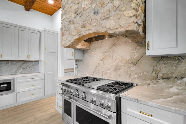 LOT34 Prancing Deer Ln, Johnson City, TX 78636 - kitchen featuring range with two ovens, wood ceiling, backsplash, beam ceiling, and light wood finished floors