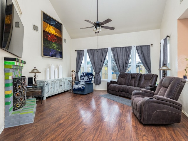 living room with high vaulted ceiling, a ceiling fan, visible vents, and dark wood-type flooring