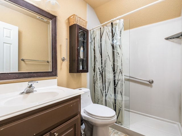 full bath with a shower stall, toilet, and vanity